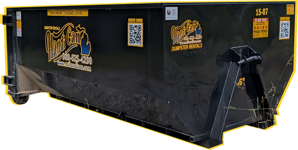 Black metal dumpster container with yellow warning labels on a white background