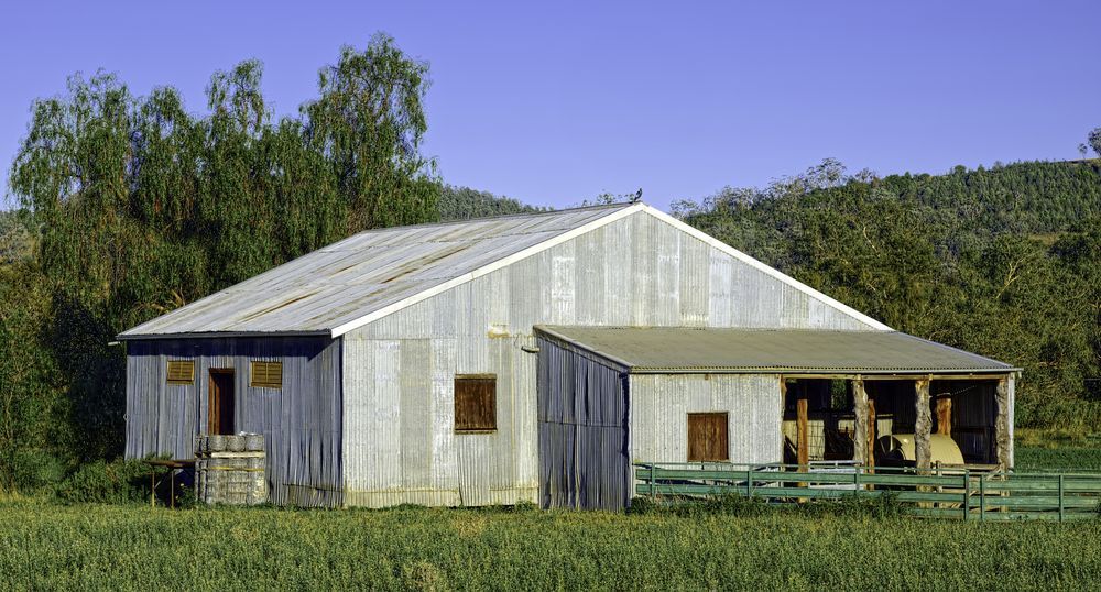 A Large Barn with A Porch in The Middle of A Field — New England Shade Sails in Tamworth, NSW