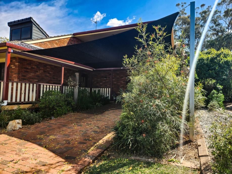 A House with A Black Shade Sail on The Roof — New England Shade Sails in Tamworth, NSW