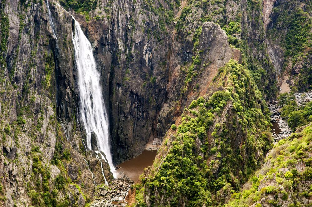 A Waterfall Is Surrounded by Trees and Rocks in The Middle of A Canyon — New England Shade Sails in Armidale, NSW