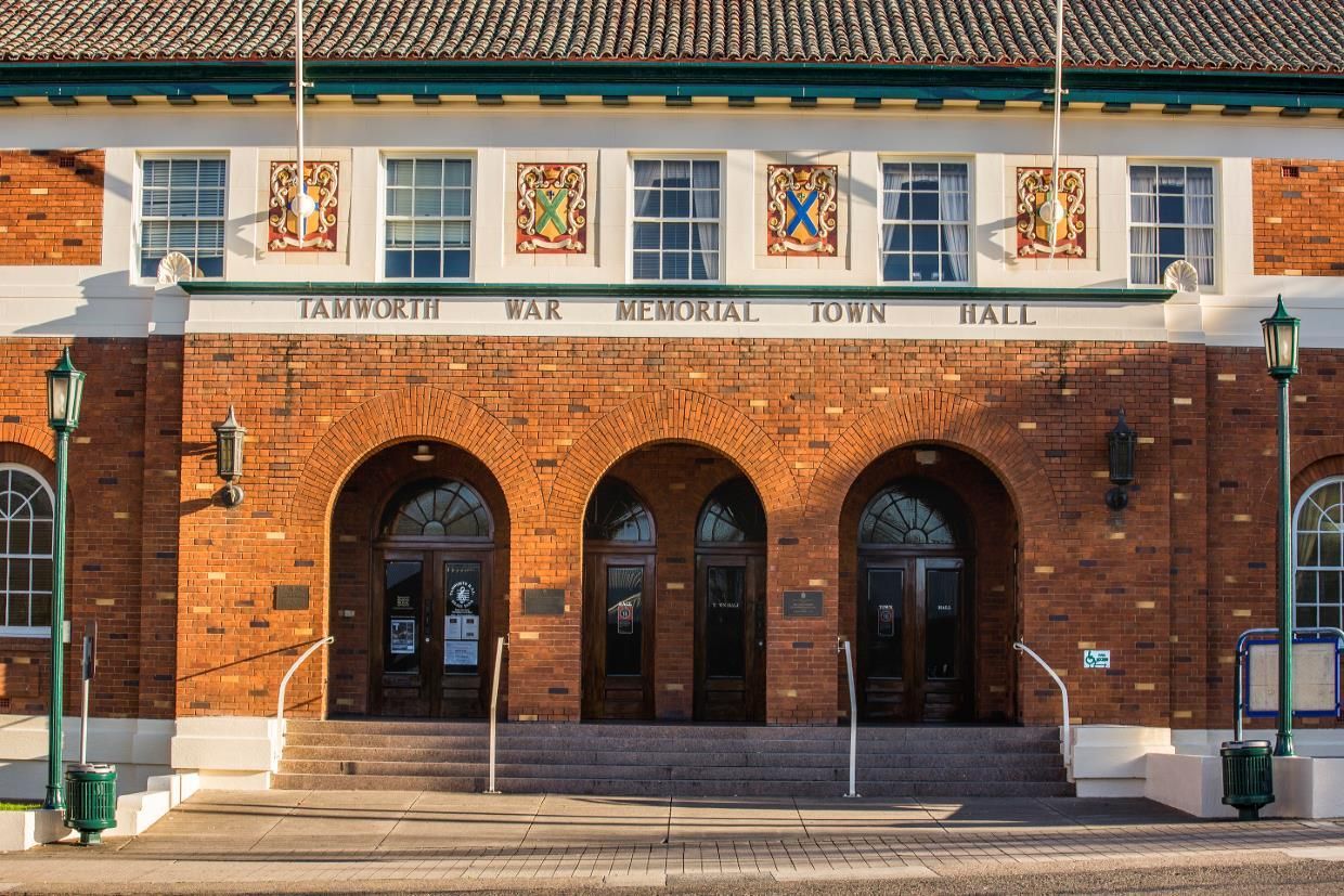 The Front of A Brick Building with Arched Doors and Stairs — New England Shade Sails in Tamworth, NSW