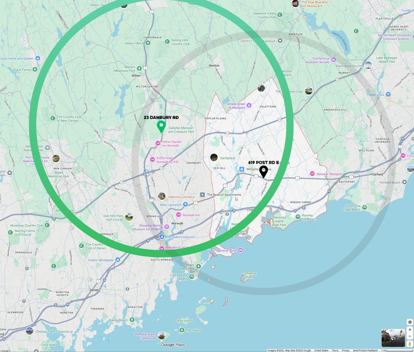Map with two green circles indicating geographic areas. Dark pin near the right.