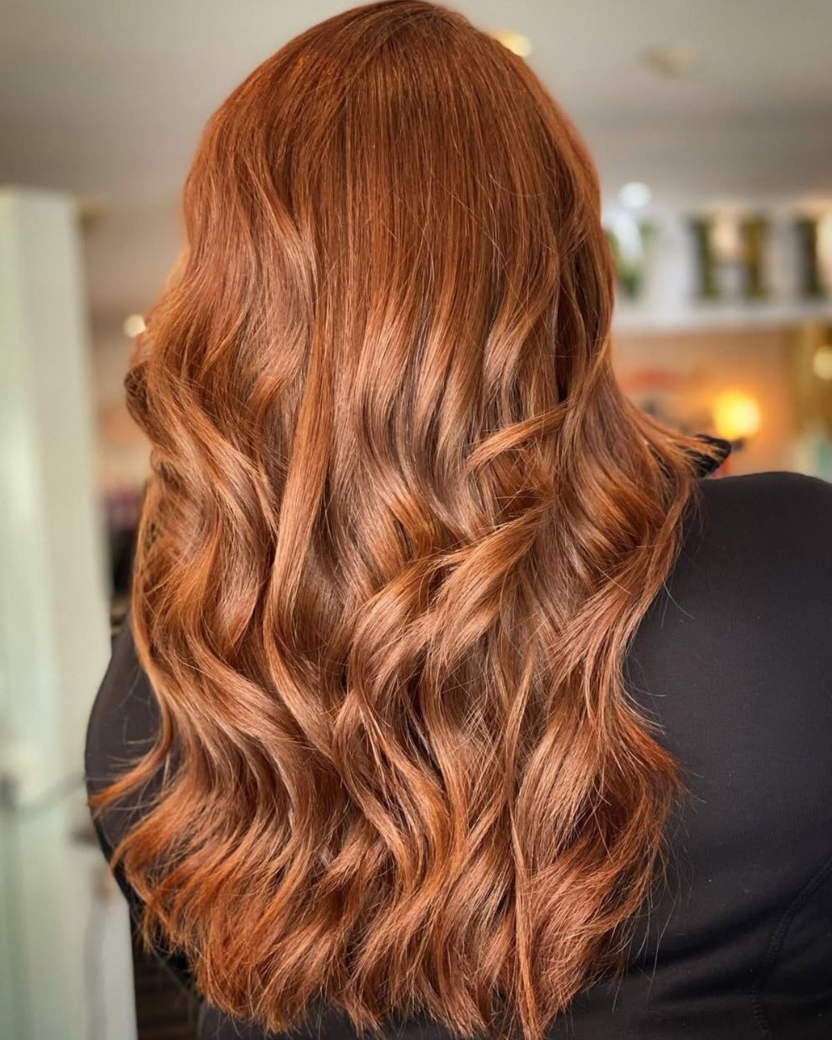 Long, wavy auburn hair.