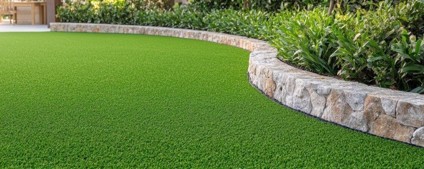 Turf and a short brick wall