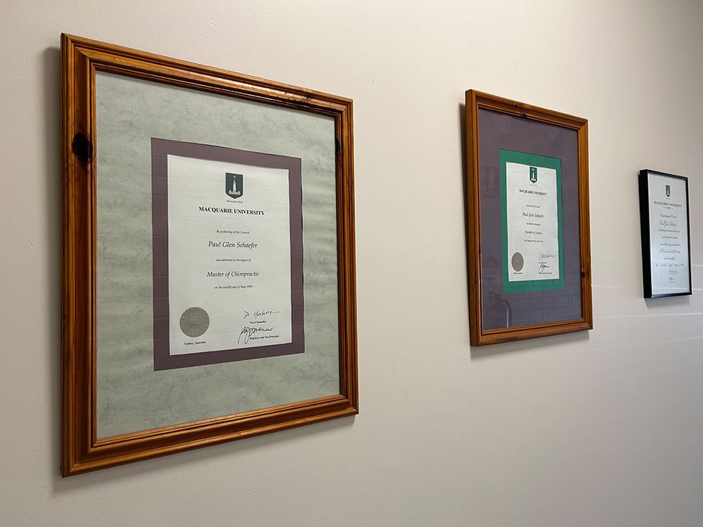 Three Framed Certificates Are Hanging On A Wall — Cobargo Chiropractic in Cobargo, NSW