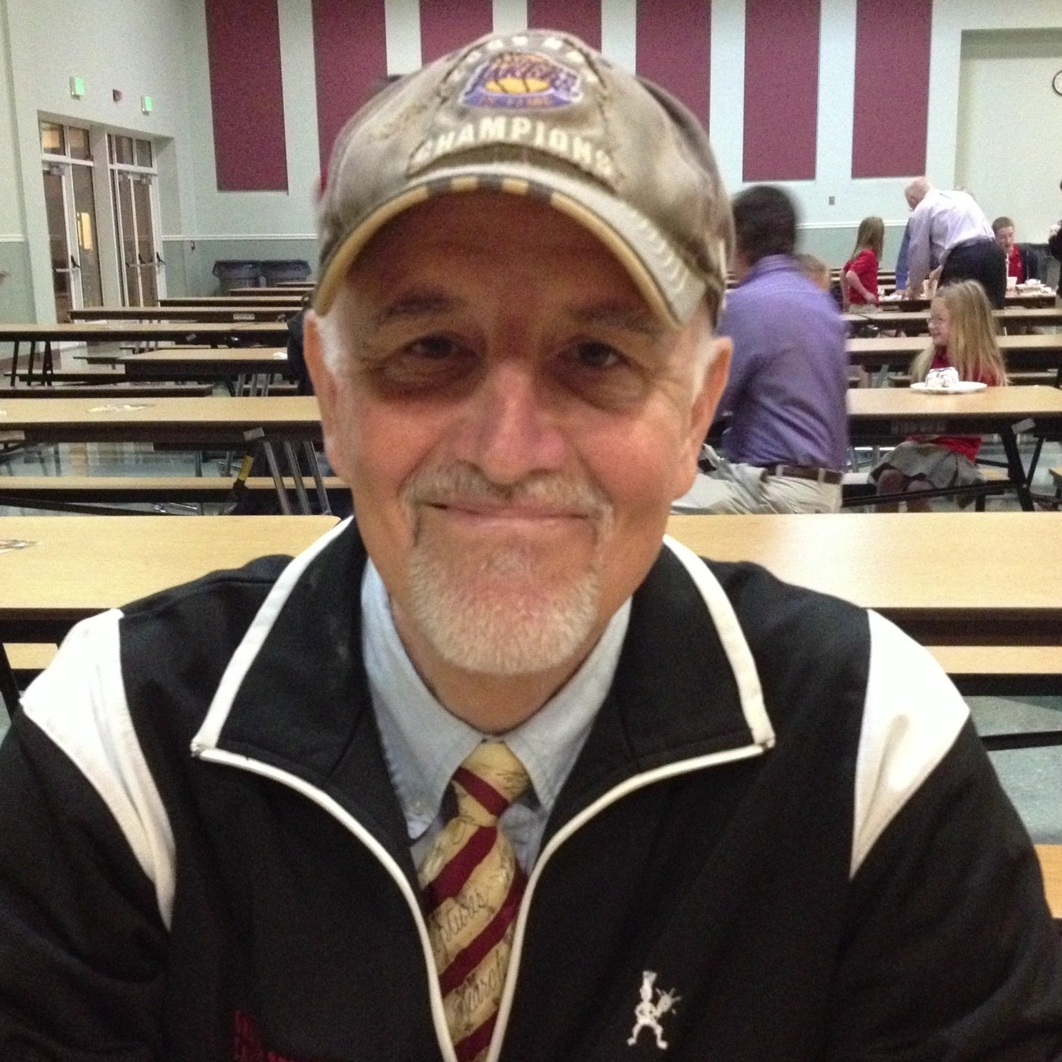 A man wearing a hat that says champions on it