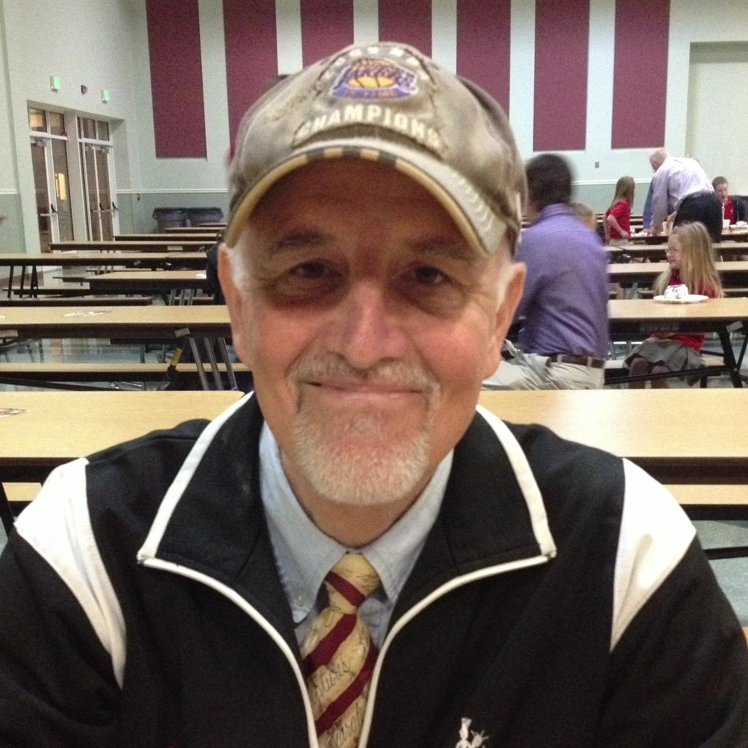 A man wearing a hat that says champions on it