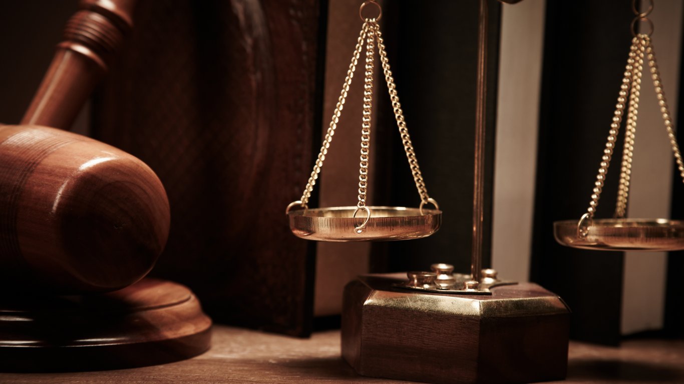 Gavel and scales of justice, symbols of law and order.