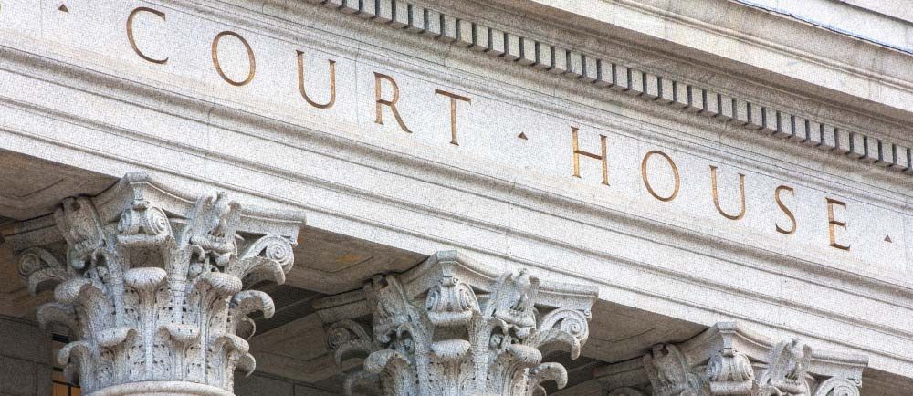 Exterior of a courthouse with the words 