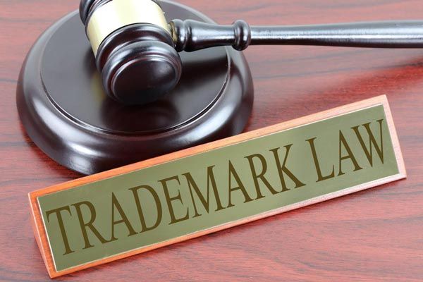 Gavel on block next to a sign that reads 