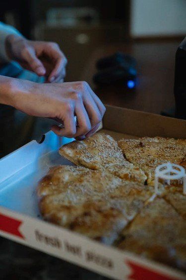 A man having pizza at home