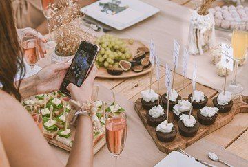taking photographs of food to post on social media