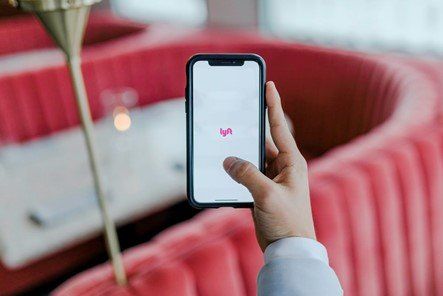 A man using a delivery app on his phone