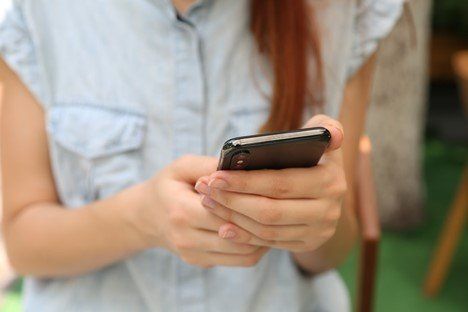 A woman ordering from a restaurant online