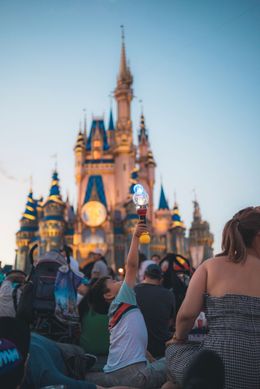 Family at Disney theme park entrance