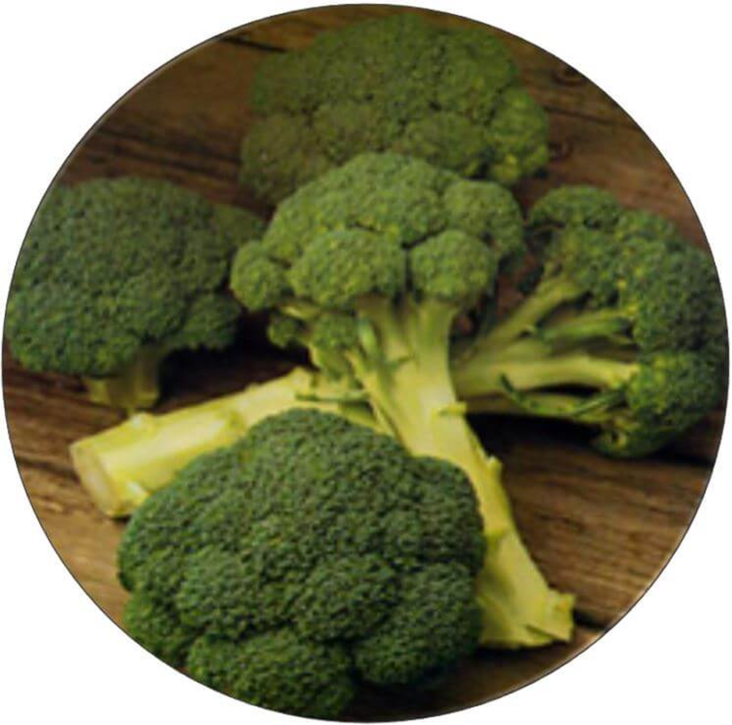 Fresh broccoli florets on a wooden surface.
