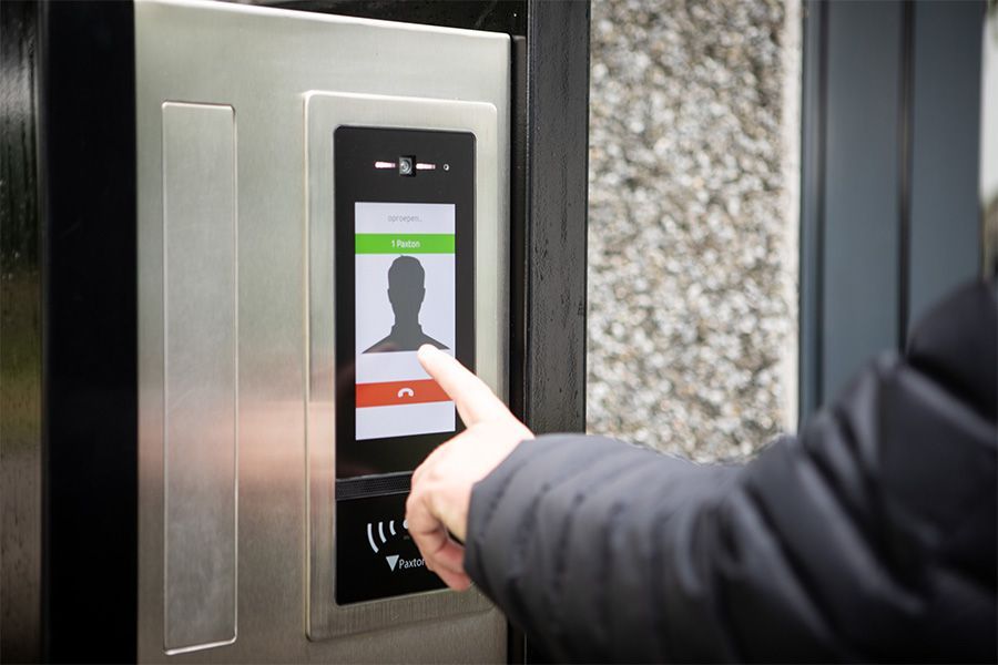 A person pressing the red 