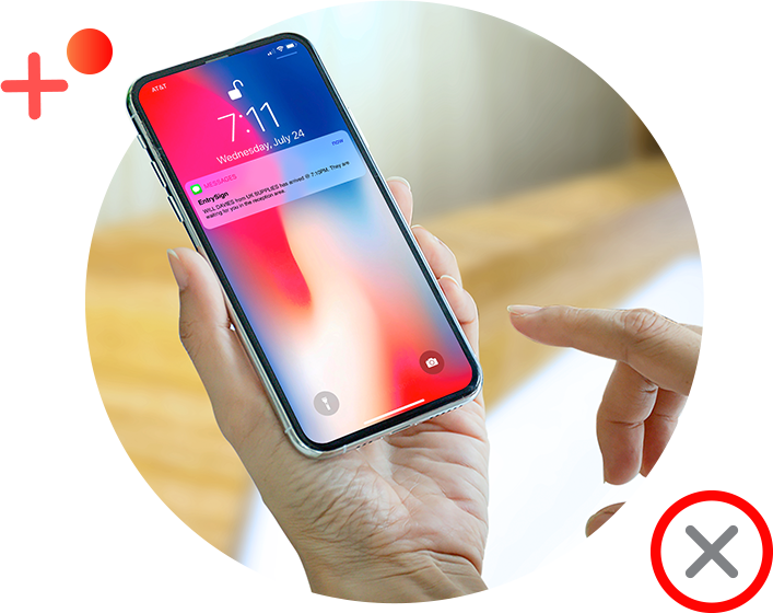 Person holding a smartphone with a notification. Finger is pointing to the screen.