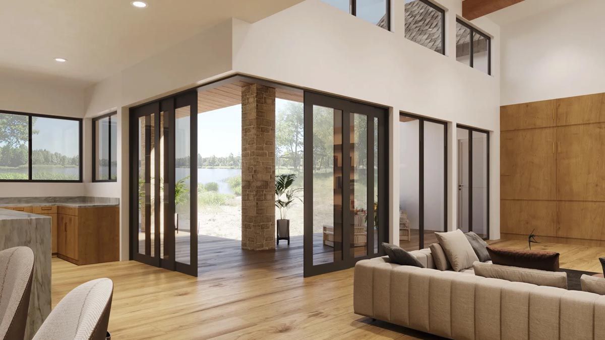 Bright modern living room with wood floors, large glass doors, and a view of the outdoors