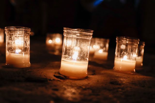 Close-up of lighted remembrance candles at a The Village, OK funeral home and cremations service honoring a loved one