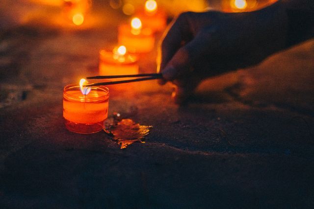Lighted memorial candles during a funeral service in The Village, OK funeral home and cremations ceremony