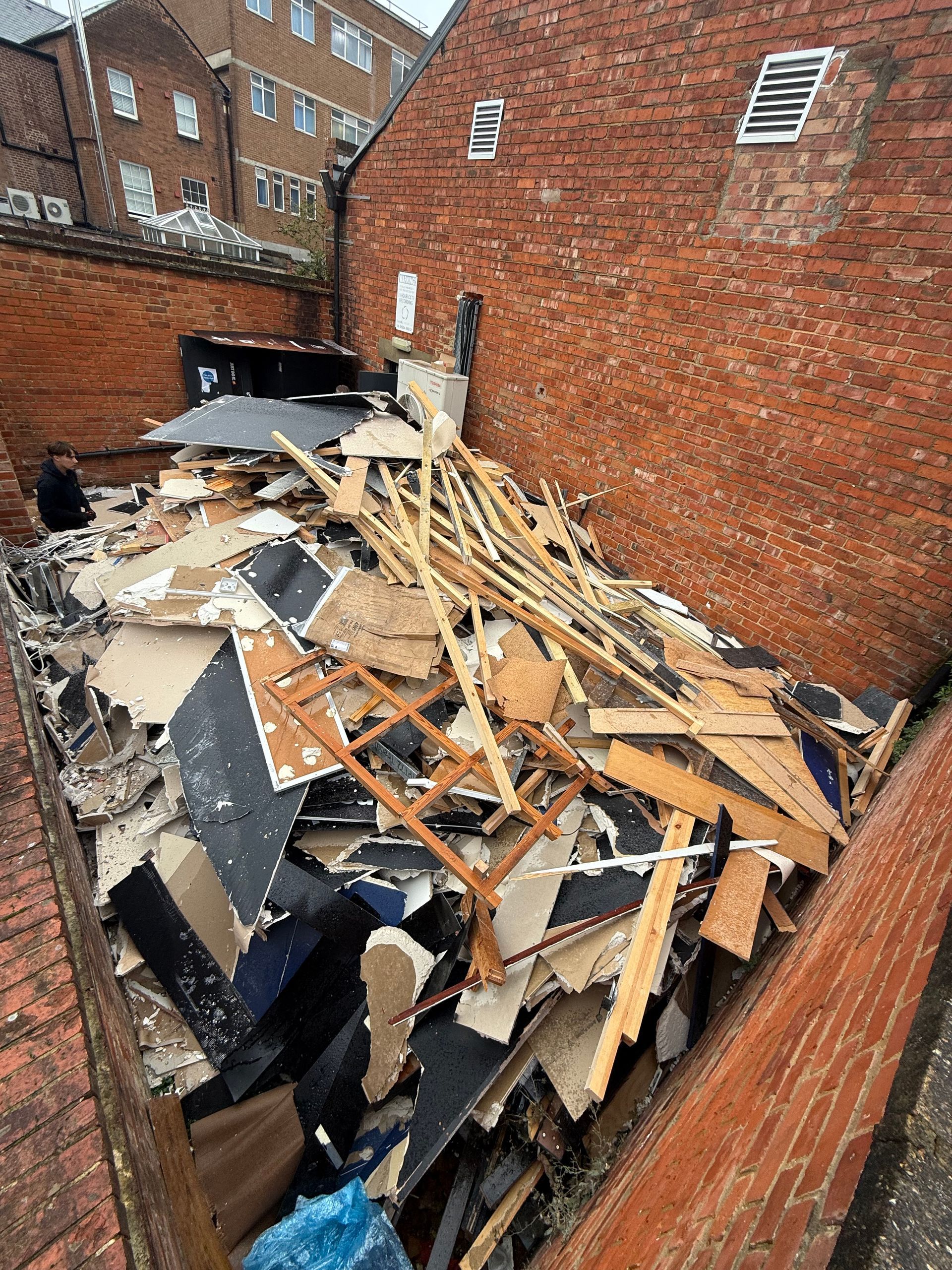 Builders waste containing plasterboard from a commercial shop strip out
