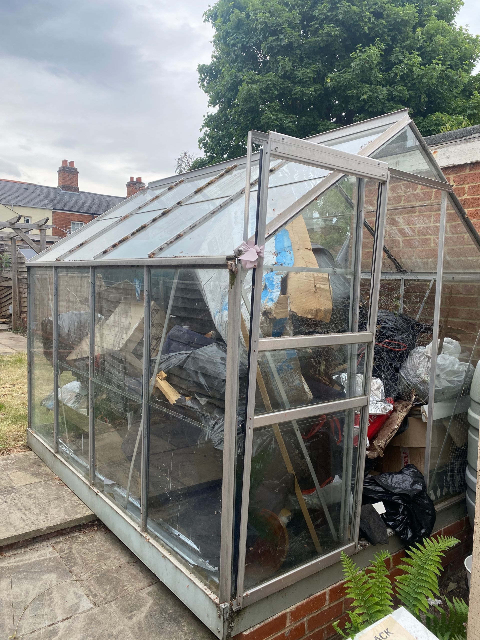 Greenhouse dismantling and removal on Western Road in Reading Berkshire