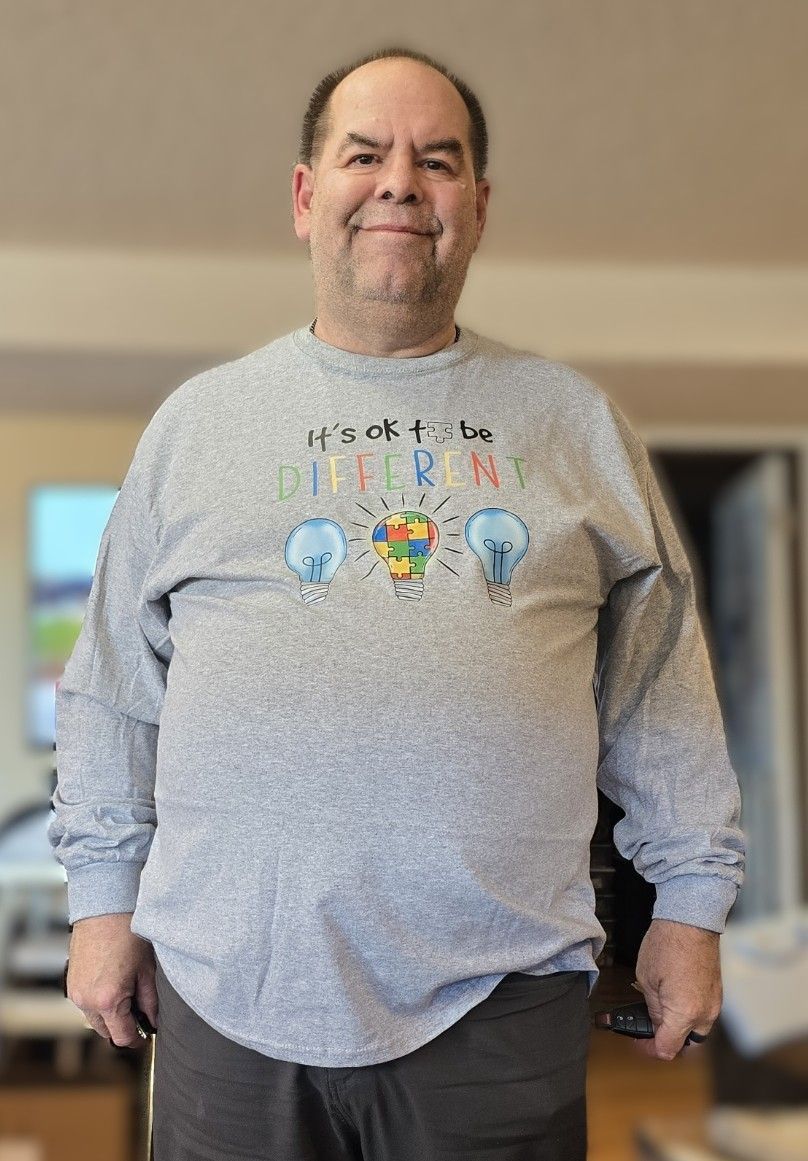 A person in a gray long-sleeved shirt with 