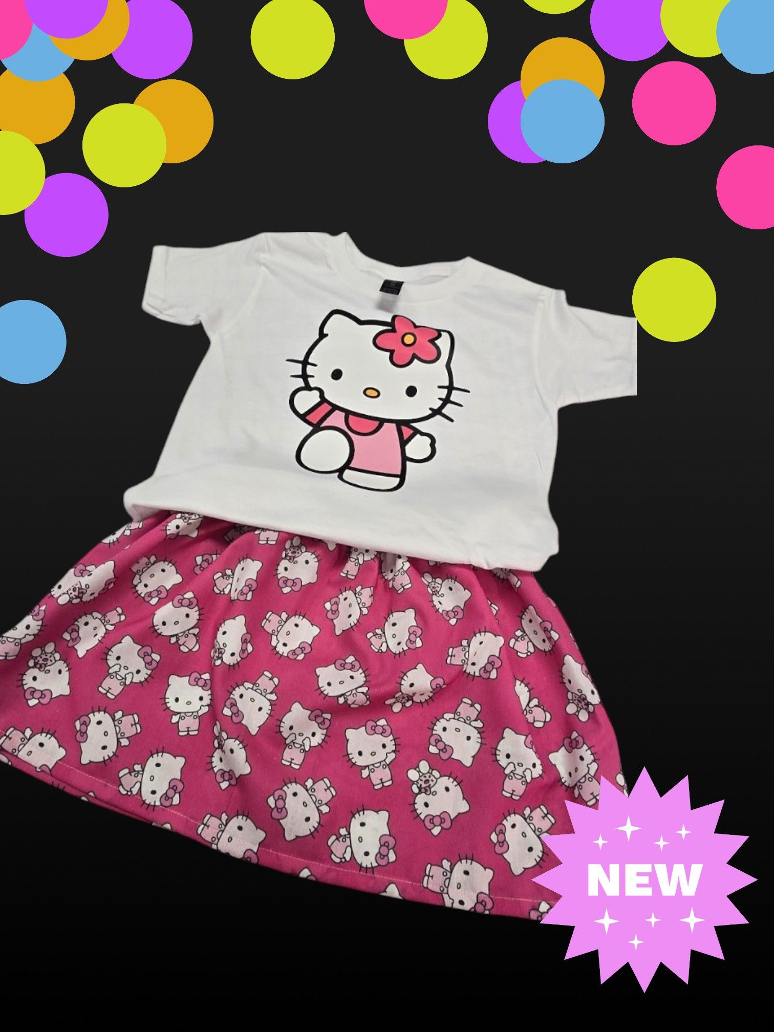 A Hello Kitty outfit with a white t-shirt and a pink patterned skirt against a black background with colorful circles.