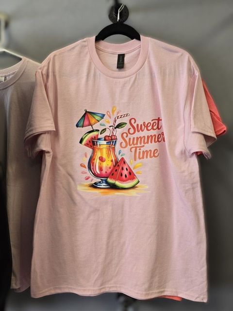 Light pink T-shirt featuring a graphic of a fruit cocktail with a watermelon slice and the text "Sweet Summer Time."