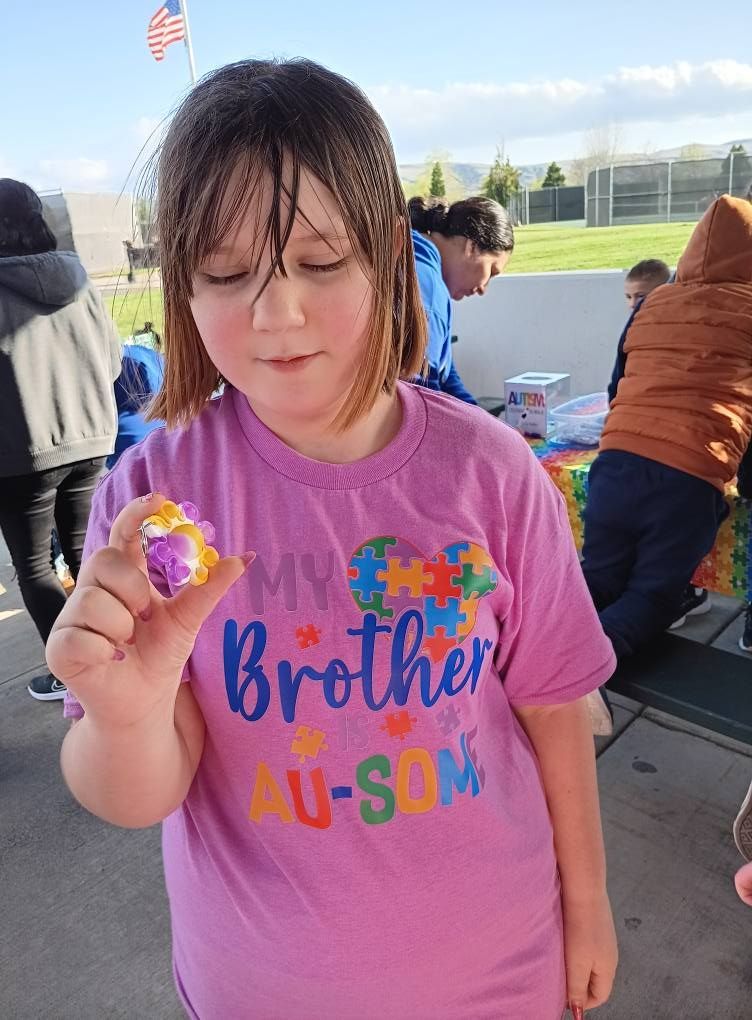 A person in a pink t-shirt with 