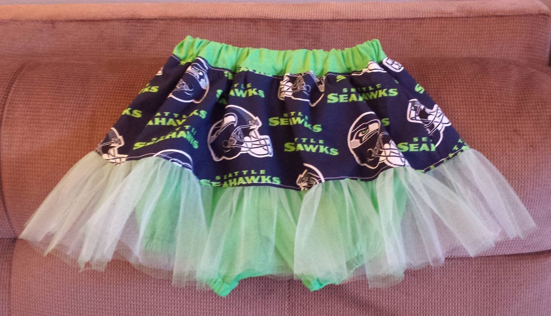 Seattle Seahawks themed toddler-size tutu skirt with green tulle and navy blue fabric featuring team logos.