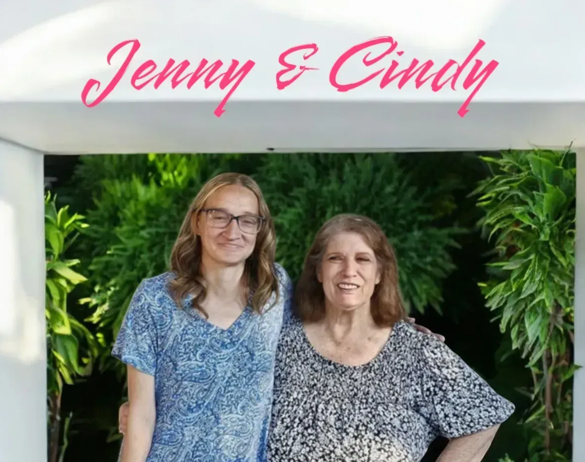 Two smiling people stand outdoors against a backdrop of lush green foliage under a header that reads,