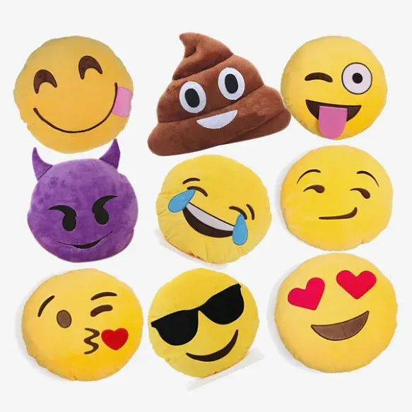 Nine plush emoji pillows in various expressions, including a poop, purple devil, laughing, kiss, and heart-eyed face.