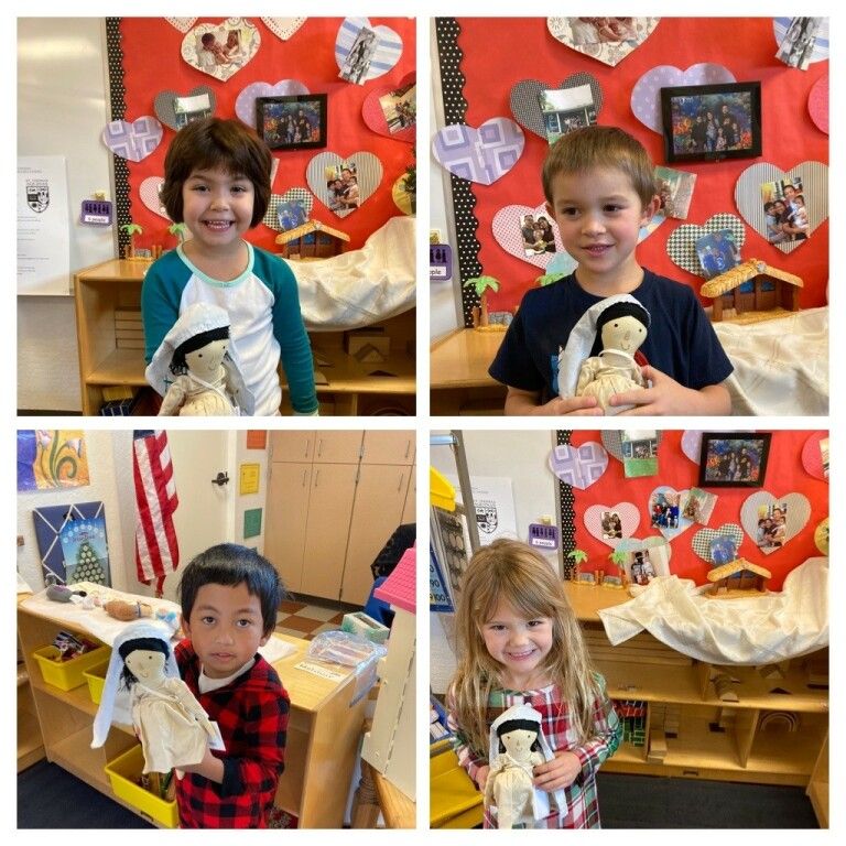 Children posing with stuffed animals in a classroom with a red heart-themed bulletin board.