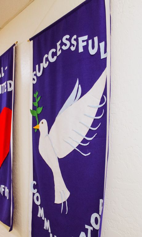 Purple banner with a white dove and the word “Successful” along the top edge