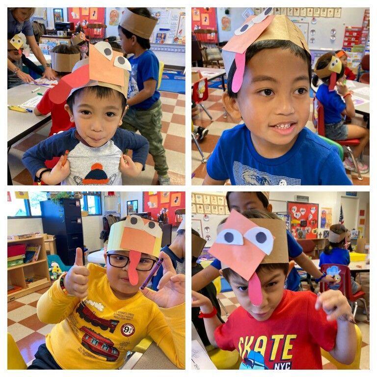 Children in a classroom wearing colorful paper animal masks and smiling at the camera