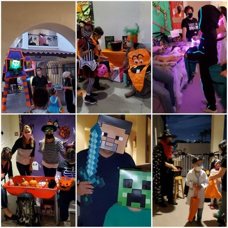 Halloween costumes and decorations at an indoor party, with children posing near a pumpkin and blocky game character backdrop