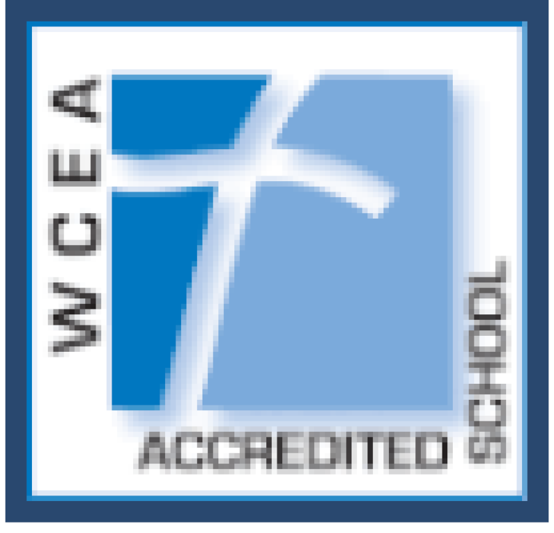 WCEA Accredited School logo with blue stylized “T” and “ACCREDITED SCHOOL” text