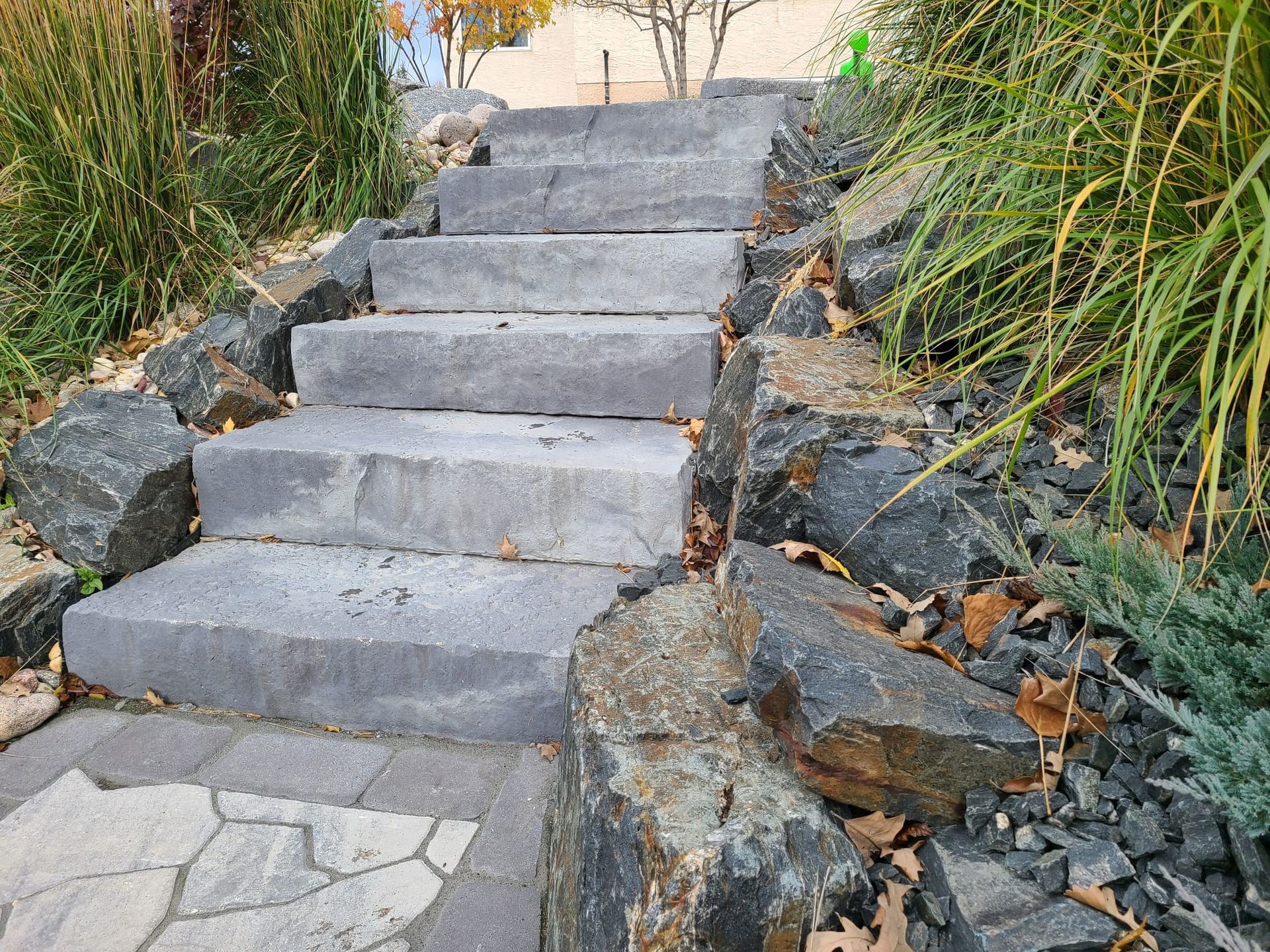A set of stairs leading up to a rock garden