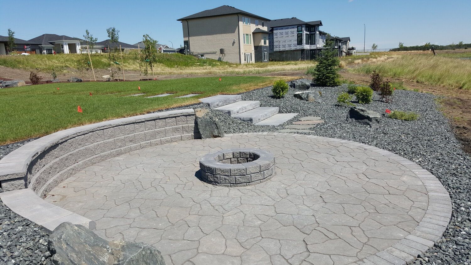 There is a fire pit in the middle of the patio.
