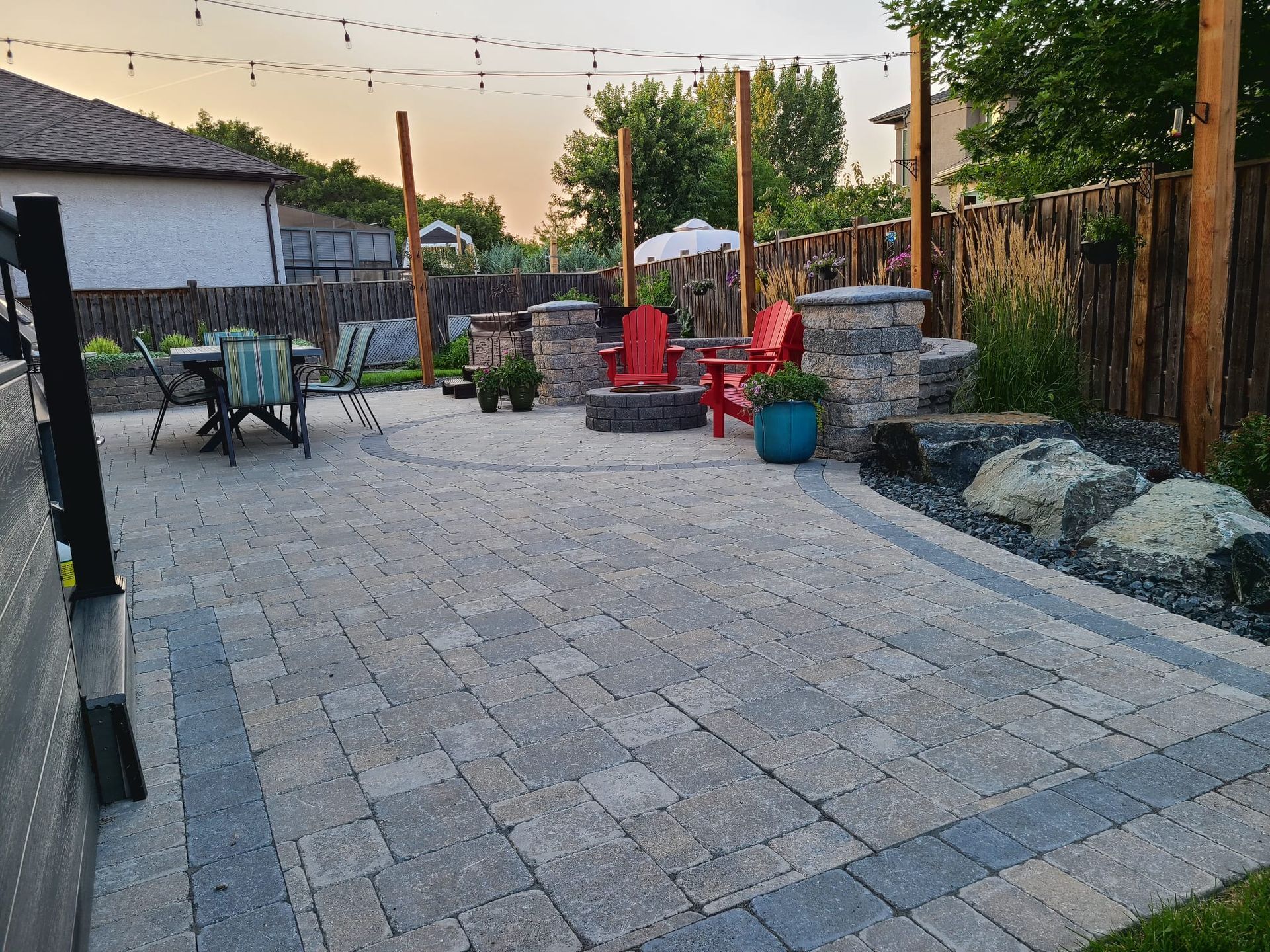 There is a fire pit in the middle of the patio.