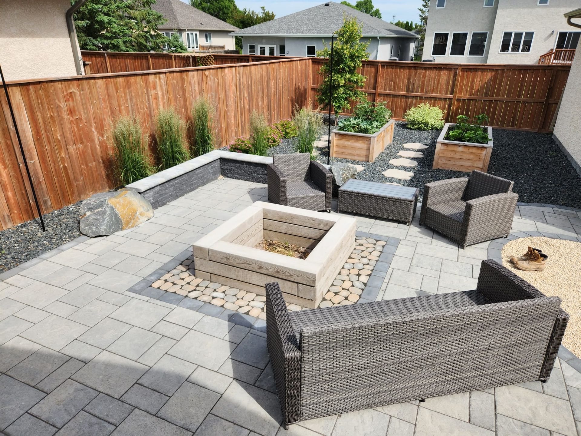 There is a fire pit in the middle of the patio.