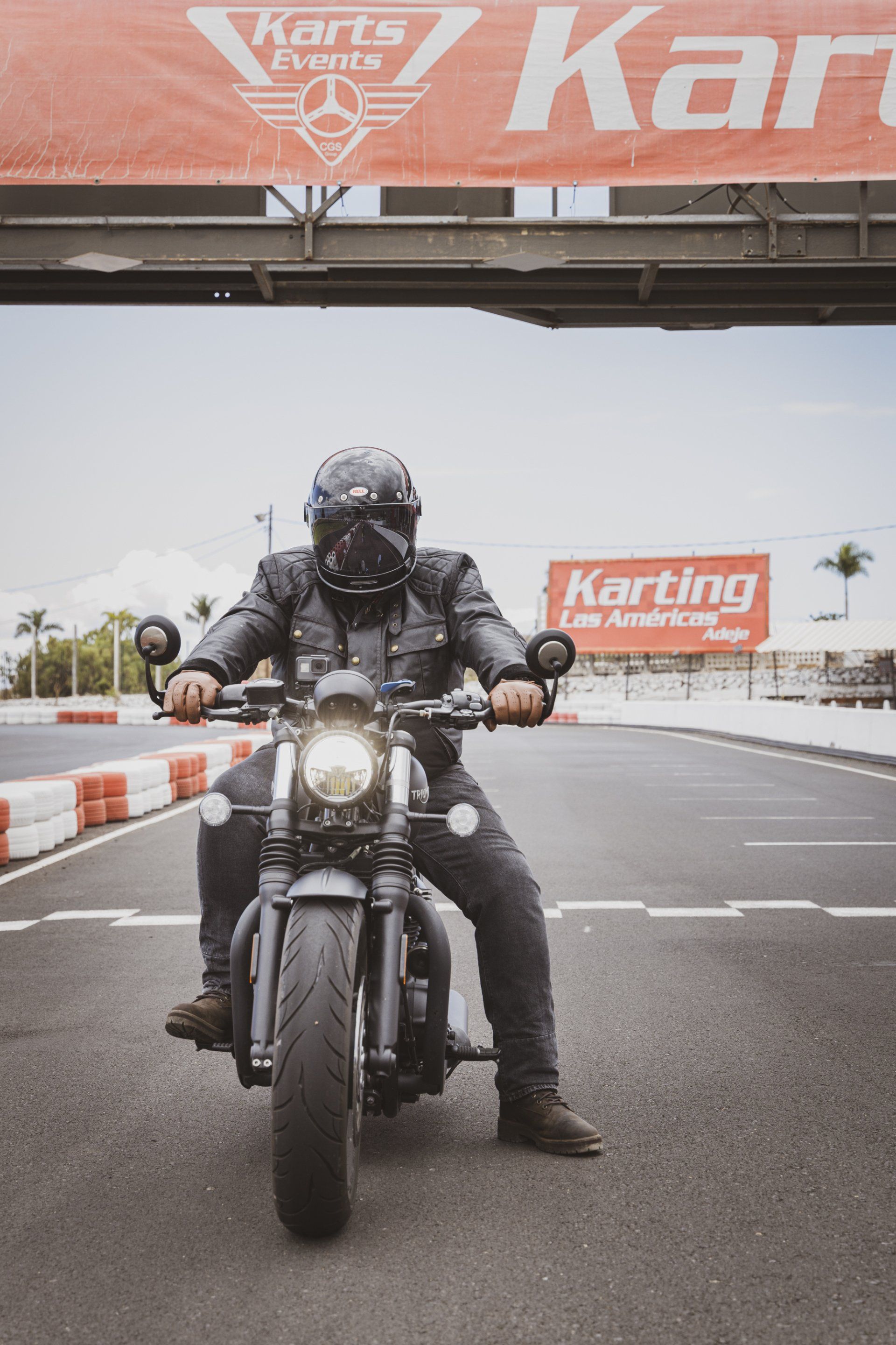 A man is riding a motorcycle on a race track.