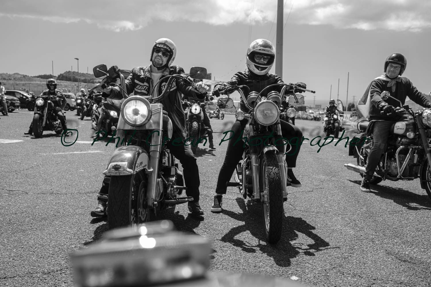 A black and white photo of a group of motorcycle riders