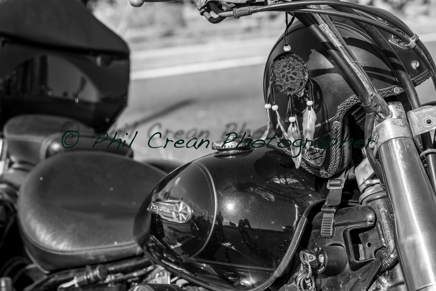A black and white photo of a motorcycle with a skull on it