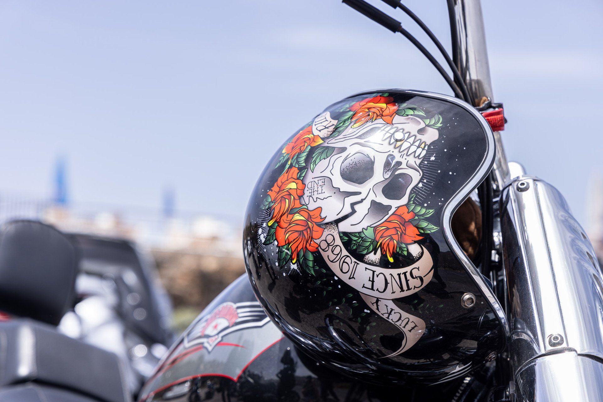 A close up of a motorcycle helmet with a skull on it