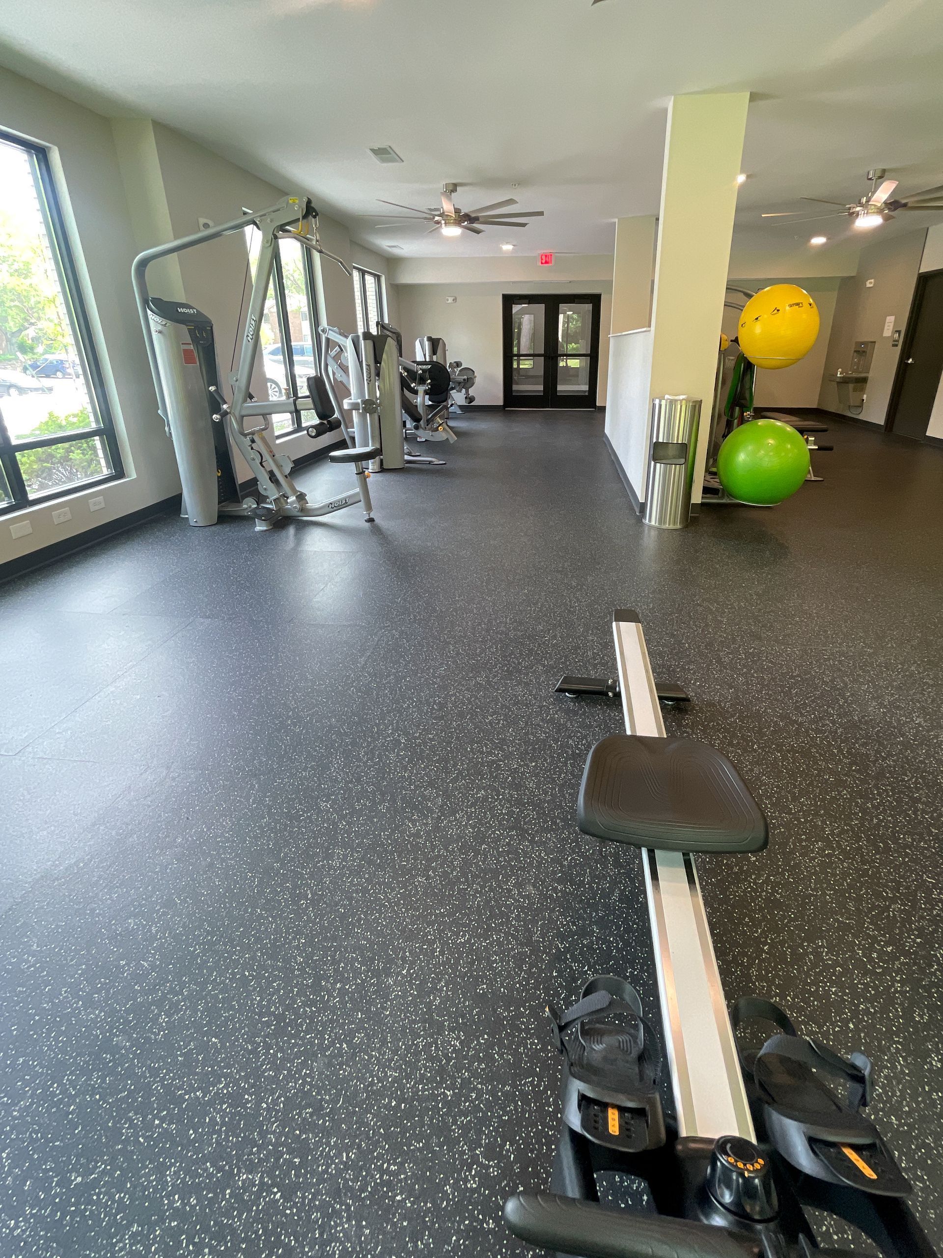 There is a bicycle in the middle of the gym.