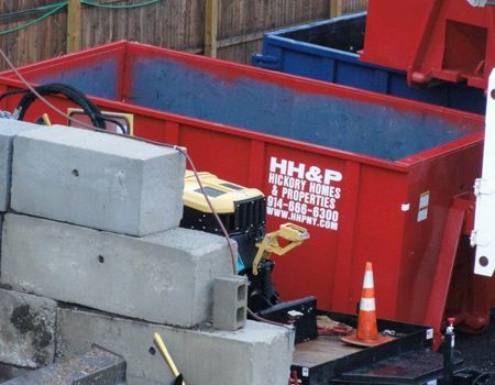 Red dumpster with the logo 