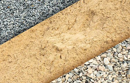 Sand and gravel of different colors and textures are displayed side by side.